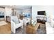 View from the living room of the kitchen and dining area with an open concept design, and lots of natural light at 527 Morrows Turnout Way, Pineville, NC 28134