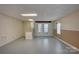 Spacious basement area featuring a kitchenette, white trim, natural light, and ample room for recreation or storage at 5306 Club View Dr, Concord, NC 28025