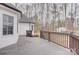View of deck with railing with back yard featuring mature trees, grass and privacy fence at 5306 Club View Dr, Concord, NC 28025