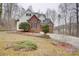 Charming two-story home with a brick facade, white siding, and landscaped front yard at 5306 Club View Dr, Concord, NC 28025