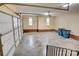 Spacious garage with high ceilings, hooks for tools, and brick accents at 5306 Club View Dr, Concord, NC 28025