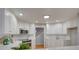 Stylish kitchen with white cabinets, stainless steel appliances, and modern countertops at 5306 Club View Dr, Concord, NC 28025