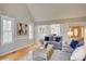 Spacious living room with hard wood flooring and large windows offering natural light at 5306 Club View Dr, Concord, NC 28025