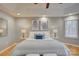 Serene main bedroom features natural light, tray ceilings, and hardwood floors at 5306 Club View Dr, Concord, NC 28025