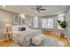 Spacious main bedroom features tray ceilings, hardwood floors, and plenty of natural light at 5306 Club View Dr, Concord, NC 28025