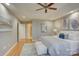 Bright main bedroom showcasing a king-sized bed, hardwood floors, and modern decor at 5306 Club View Dr, Concord, NC 28025