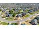 Aerial view of a neighborhood showcasing manicured lawns and mature trees in a desirable residential community at 5608 Old Town Ln, Gastonia, NC 28056
