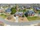 Stunning aerial view of a beautiful brick home with a manicured lawn and mature trees in a desirable community at 5608 Old Town Ln, Gastonia, NC 28056