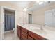 Bright bathroom with double sink vanity, large mirror, and a separate toilet room at 5608 Old Town Ln, Gastonia, NC 28056