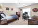 Cozy bedroom features neutral walls, carpeted floors, and a window for natural light at 5608 Old Town Ln, Gastonia, NC 28056