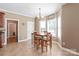 Charming breakfast nook with a cozy table and chairs, bright bay windows, and neutral décor at 5608 Old Town Ln, Gastonia, NC 28056