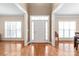 Elegant foyer showcasing hardwood floors and abundant natural light from side windows at 5608 Old Town Ln, Gastonia, NC 28056