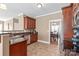 Spacious kitchen features stainless steel appliances, granite counters, tile floor and backyard view at 5608 Old Town Ln, Gastonia, NC 28056