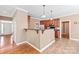 Kitchen with modern stainless-steel appliances, granite counters, and hardwood floors at 5608 Old Town Ln, Gastonia, NC 28056