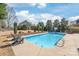 Inviting pool with manicured landscaping and ample deck space for outdoor enjoyment at 5608 Old Town Ln, Gastonia, NC 28056