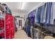 Spacious walk-in closet filled with organized clothing and shelving at 5608 Old Town Ln, Gastonia, NC 28056