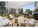 Spacious wooden deck area with outdoor seating and grill under shade at 6614 Redbridge Trl, Charlotte, NC 28269