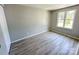 Bedroom with a window and flooring at 7812 Highbanks Ct, Charlotte, NC 28212