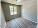 Bedroom with a window and flooring at 7812 Highbanks Ct, Charlotte, NC 28212