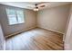 Bedroom with a window and flooring at 7812 Highbanks Ct, Charlotte, NC 28212