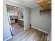 View of the kitchen with stainless steel appliances and updated lighting at 7812 Highbanks Ct, Charlotte, NC 28212