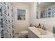 Cozy bathroom featuring a shower with a patterned curtain, and a sink with a mirror at 810 Ashwood St, Kannapolis, NC 28081