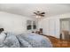 Cozy bedroom with hardwood floors, a ceiling fan, and large windows for ample natural light at 810 Ashwood St, Kannapolis, NC 28081