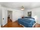 Bright bedroom with hardwood floors, closet, and an adjacent room, creating a relaxing atmosphere at 810 Ashwood St, Kannapolis, NC 28081