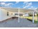 Spacious covered carport with gravel area, fenced in yard, and access to the home at 810 Ashwood St, Kannapolis, NC 28081