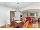 Charming dining room showcases seamless flow into the adjacent living room, perfect for gatherings at 810 Ashwood St, Kannapolis, NC 28081