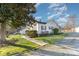 Charming home with a lush lawn, mature trees, and a paved walkway at 810 Ashwood St, Kannapolis, NC 28081