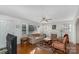 Bright living room with hardwood floors, a decorative fireplace, and comfortable furniture at 810 Ashwood St, Kannapolis, NC 28081
