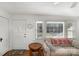 Cozy living room featuring wood floors, natural light, and comfortable seating at 810 Ashwood St, Kannapolis, NC 28081