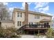 A well-maintained backyard with a wooden deck, ideal for outdoor gatherings and relaxation at 8909 Abberley Ct, Huntersville, NC 28078
