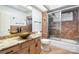 Bathroom with unique vessel sink, granite countertop, stylish fixtures, and a tile-surround shower at 8909 Abberley Ct, Huntersville, NC 28078