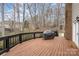 Spacious wooden deck with a grill, providing a relaxing outdoor living space overlooking the backyard at 8909 Abberley Ct, Huntersville, NC 28078
