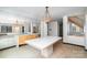 Open dining room featuring chandelier lighting, large windows, and mirrored walls at 8909 Abberley Ct, Huntersville, NC 28078
