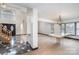Elegant entryway with marble flooring, staircase and dining room with large windows at 8909 Abberley Ct, Huntersville, NC 28078