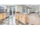 Bright kitchen with granite countertop island, ample cabinet space, and access to outdoor deck at 8909 Abberley Ct, Huntersville, NC 28078