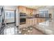 Spacious kitchen featuring light wood cabinets, stainless steel appliances, and granite countertops at 8909 Abberley Ct, Huntersville, NC 28078