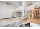 Spacious living room with high ceilings, a wooden staircase, and large windows at 8909 Abberley Ct, Huntersville, NC 28078
