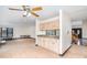 Cozy living area featuring built-in bar area with granite countertop, carpet flooring, and ample space at 8909 Abberley Ct, Huntersville, NC 28078