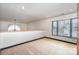 Bright loft space featuring natural light from windows, neutral carpet, and white walls at 8909 Abberley Ct, Huntersville, NC 28078