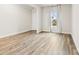 A spacious bedroom with wood floors and a window with beautiful natural light at 916 Clementine Rd, Monroe, NC 28110