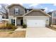 Traditional home with a two-car garage, neutral siding, and a well-manicured lawn at 916 Clementine Rd, Monroe, NC 28110