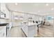 Bright, open kitchen featuring a granite island, stainless steel appliances, and lots of natural light at 916 Clementine Rd, Monroe, NC 28110