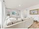 A bright living room with a comfortable couch, and a stylish mirror at 916 Clementine Rd, Monroe, NC 28110
