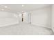Versatile loft space featuring neutral carpeting, ample natural light, and open access to the rest of the home at 916 Clementine Rd, Monroe, NC 28110