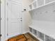 Well-organized mudroom with built-in storage, coat hooks, a bench, and easy access to the outdoors at 916 Clementine Rd, Monroe, NC 28110