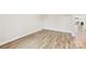 A spacious room with wood floors and neutral walls at 916 Clementine Rd, Monroe, NC 28110